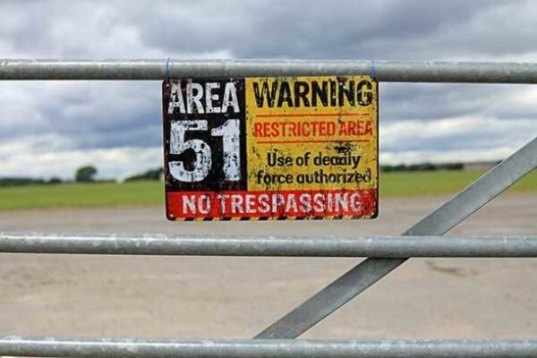 gate with warning sign saying AREA 51 restricted area