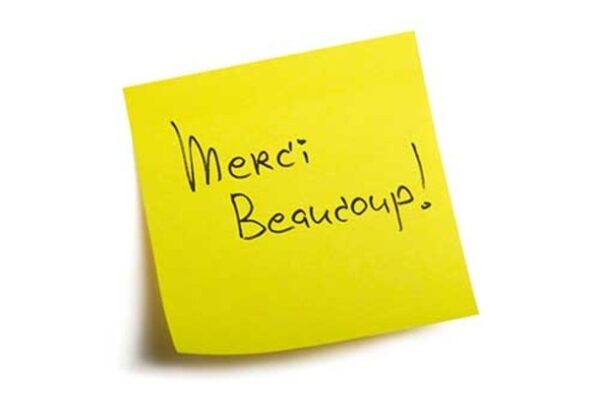 post-it with Merci Beaucoup! written on it