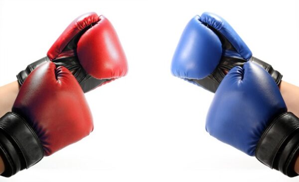 2 pairs of handings, one wearing red boxing gloves, the other blue boxing gloves