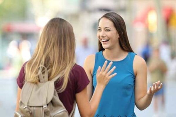 2 young women chatting in the street